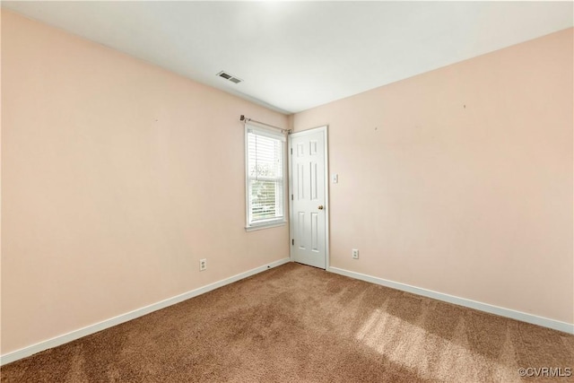 empty room featuring carpet flooring