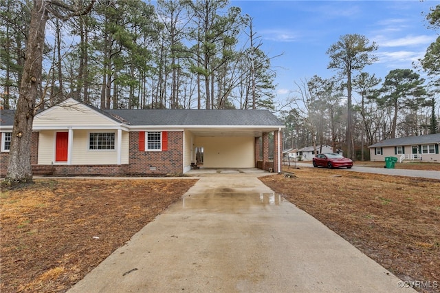 single story home featuring a carport