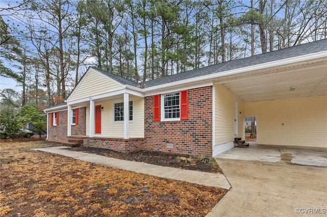 single story home featuring a carport