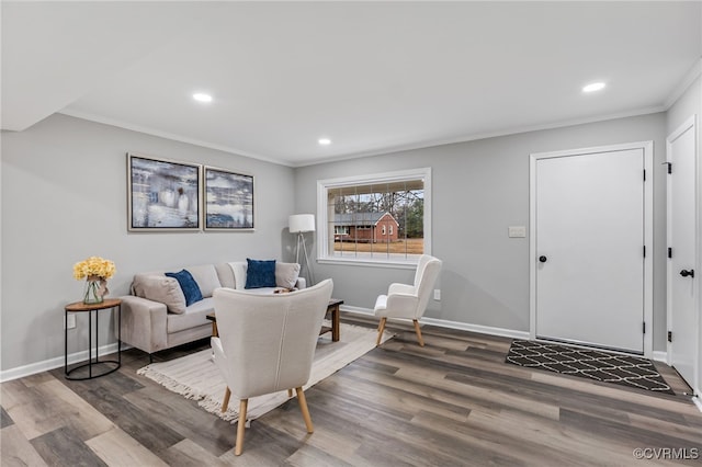 living room with crown molding and dark hardwood / wood-style floors