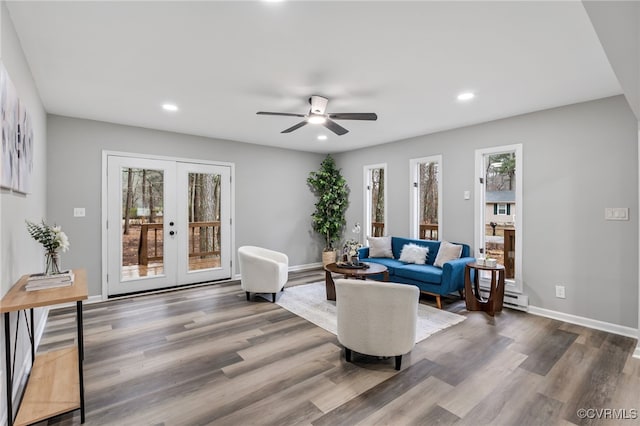 living room with french doors, a baseboard radiator, ceiling fan, and hardwood / wood-style flooring