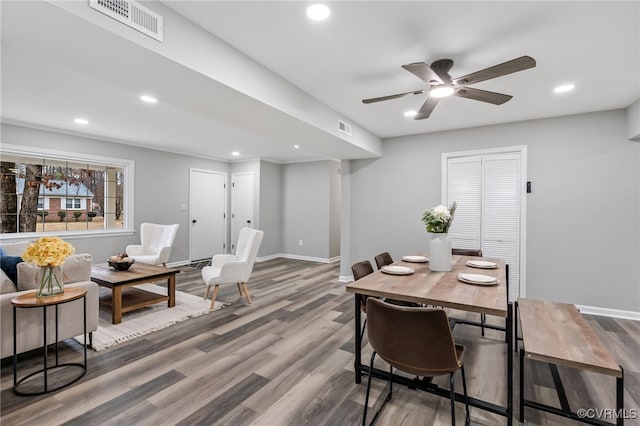 dining room with ceiling fan and wood-type flooring