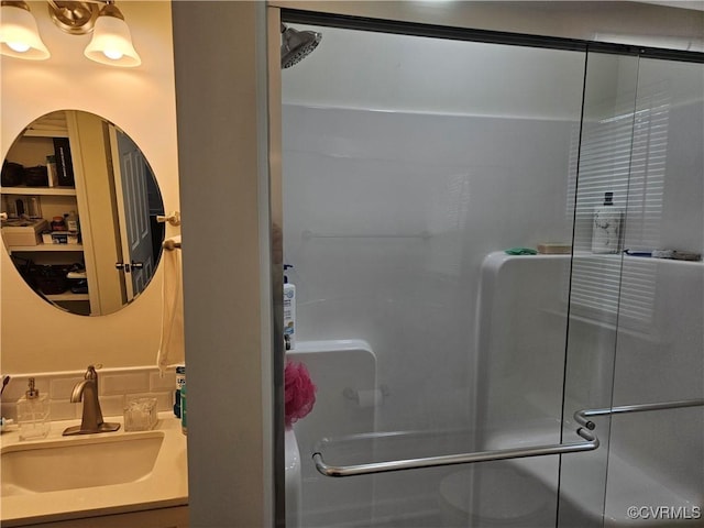 bathroom with vanity and a stall shower