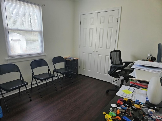 office area with dark wood-type flooring and a healthy amount of sunlight
