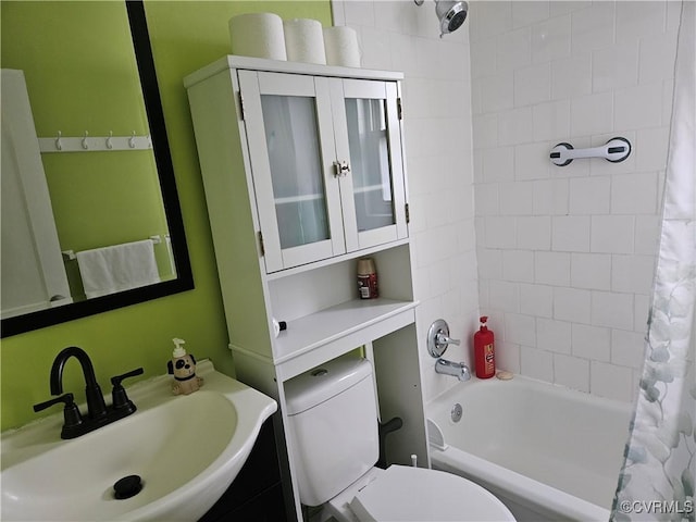 full bath featuring shower / bath combo, a sink, and toilet