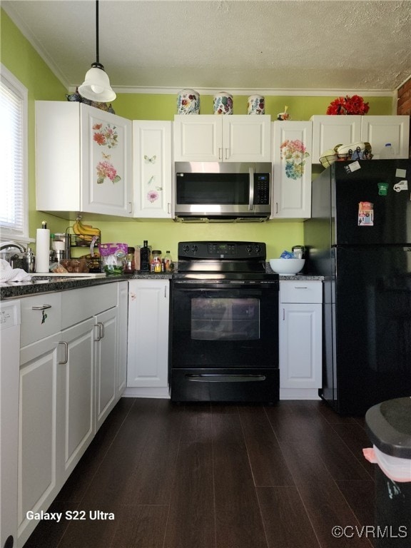 kitchen featuring dark wood finished floors, black appliances, white cabinetry, and crown molding
