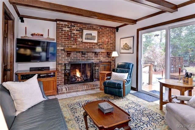 living area featuring ornamental molding, beam ceiling, a fireplace, and light tile patterned floors