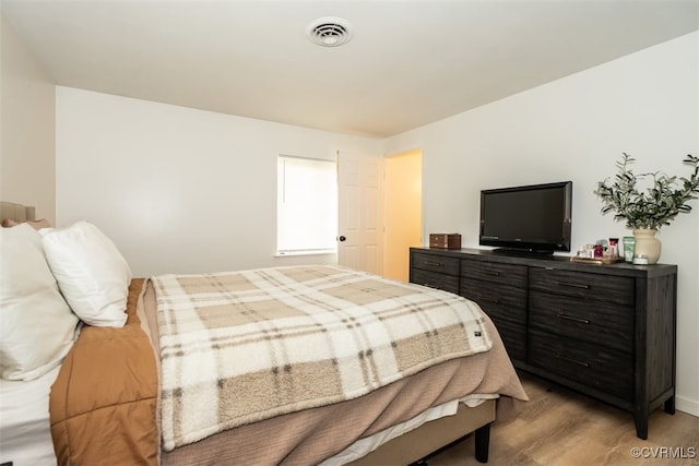 bedroom featuring light hardwood / wood-style flooring