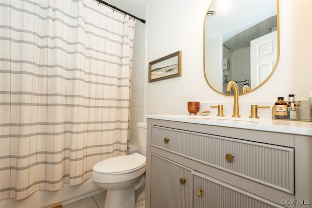 full bathroom with tile patterned flooring, vanity, shower / tub combo, and toilet