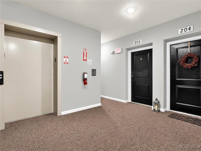 interior space featuring carpet and elevator