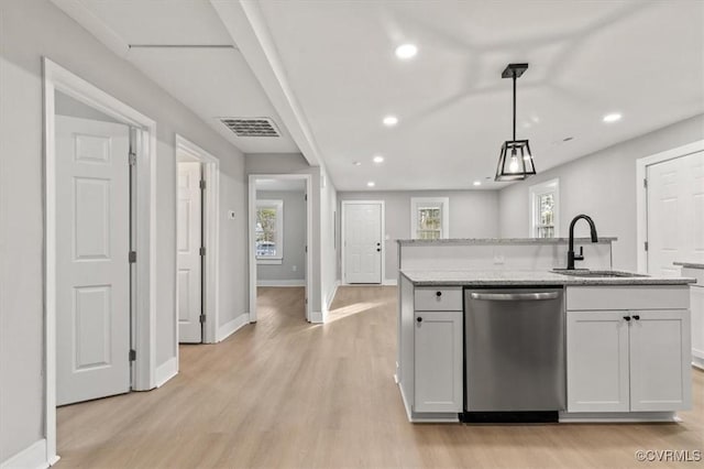 kitchen featuring recessed lighting, visible vents, stainless steel dishwasher, light wood-style floors, and a sink