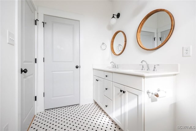 full bath featuring a sink and double vanity