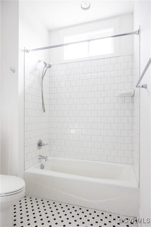 full bathroom with shower / bath combination, toilet, and tile patterned floors