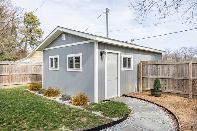 view of outbuilding with an outbuilding and a fenced backyard