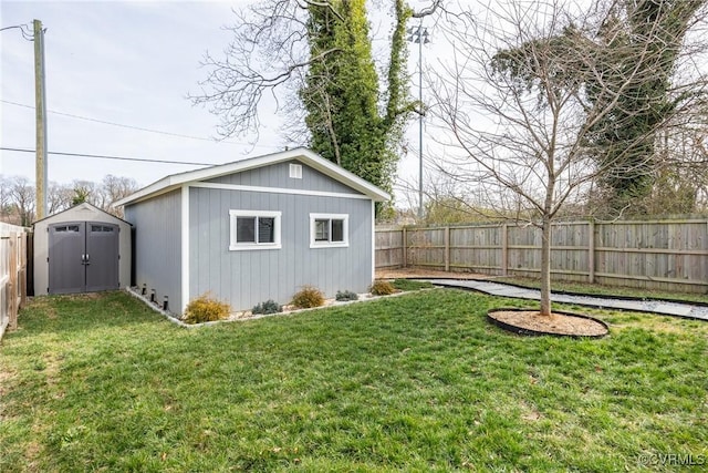 view of outbuilding with an outbuilding and a fenced backyard