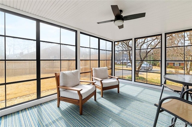 sunroom with a wealth of natural light and ceiling fan