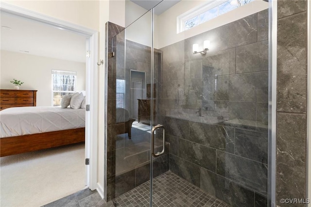 bathroom with a shower stall, plenty of natural light, and ensuite bathroom