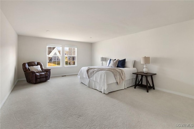 bedroom featuring visible vents, baseboards, and carpet flooring