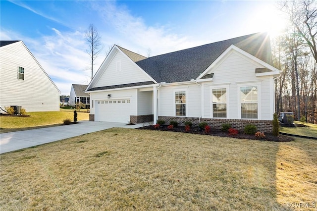 view of front of property with brick siding, a front yard, a garage, cooling unit, and driveway