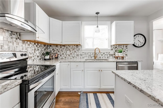 kitchen with white cabinetry, stainless steel appliances, a sink, and exhaust hood