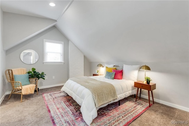 carpeted bedroom featuring vaulted ceiling and baseboards