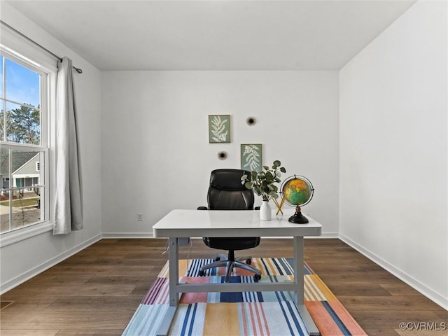 office space with dark hardwood / wood-style flooring