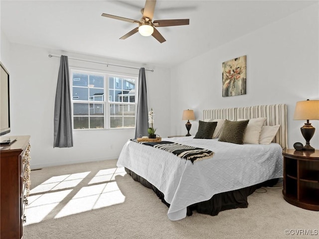 bedroom with light colored carpet and ceiling fan