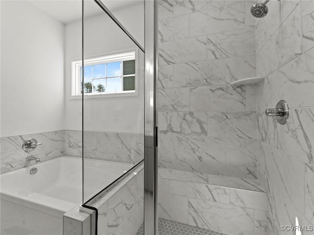 full bath with a garden tub and a marble finish shower