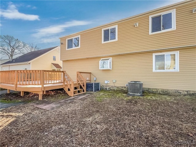 back of property with a wooden deck and central AC unit