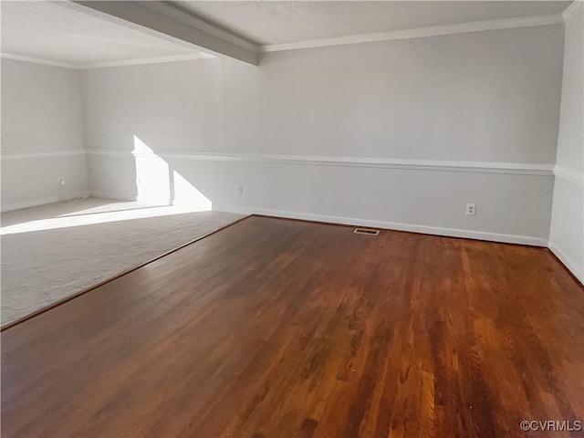 spare room with ornamental molding and hardwood / wood-style floors