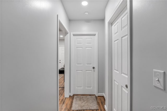 corridor featuring dark hardwood / wood-style flooring