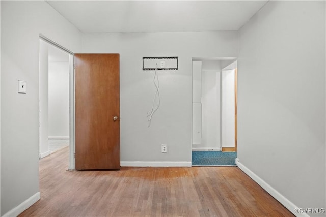 unfurnished bedroom with light wood-type flooring