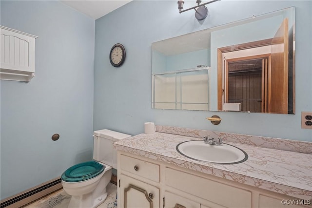 bathroom with a baseboard radiator, vanity, and toilet