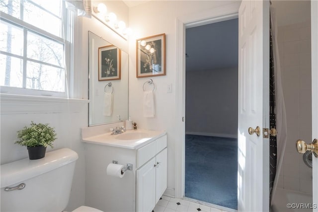 bathroom featuring vanity and toilet