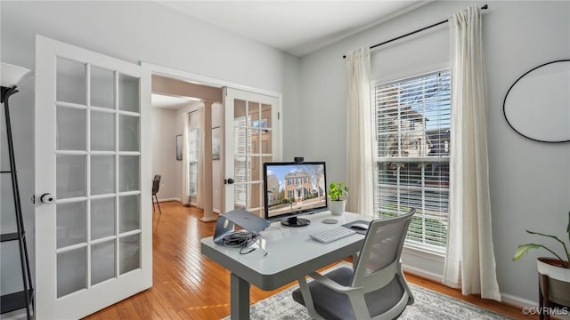 office with french doors and wood-type flooring