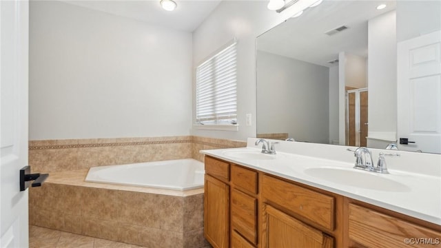 bathroom with separate shower and tub, tile patterned flooring, and vanity