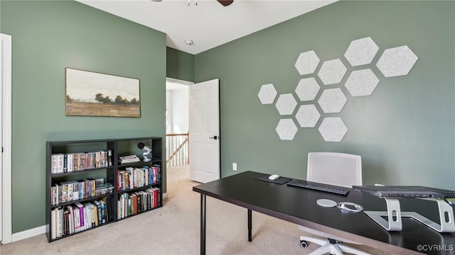 carpeted office with ceiling fan