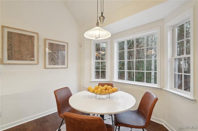 dining area with vaulted ceiling