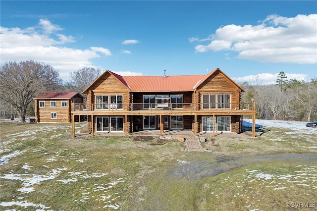 snow covered property with a wooden deck