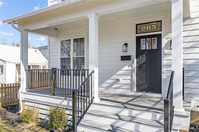 entrance to property featuring covered porch