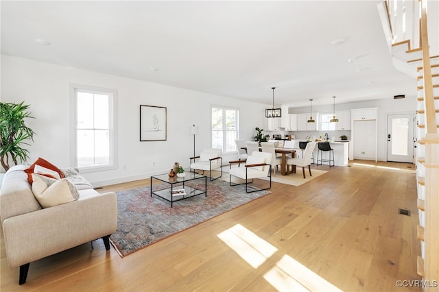 living room with light hardwood / wood-style flooring