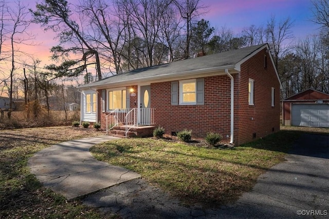 view of front of property with a garage and an outdoor structure