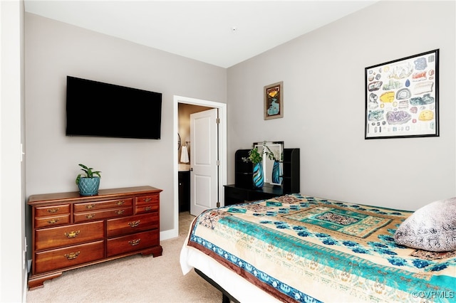 bedroom featuring light carpet