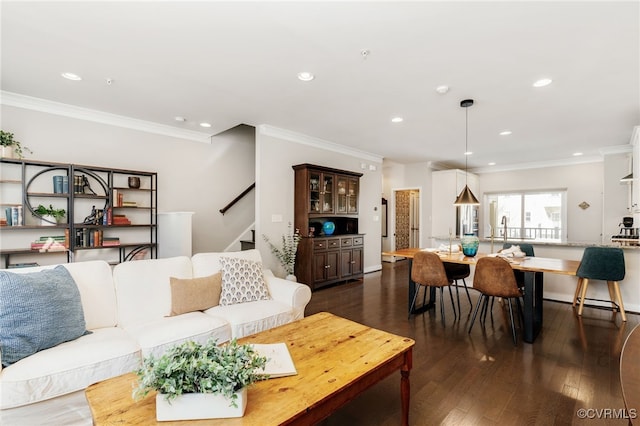 living room with stairs, ornamental molding, dark wood-style flooring, and recessed lighting