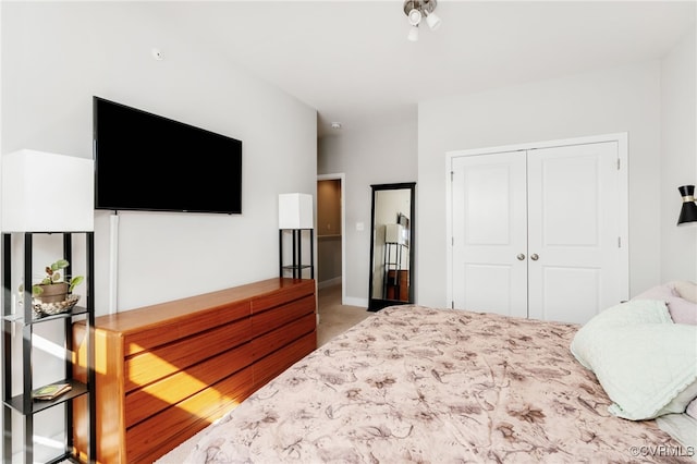 carpeted bedroom with a closet