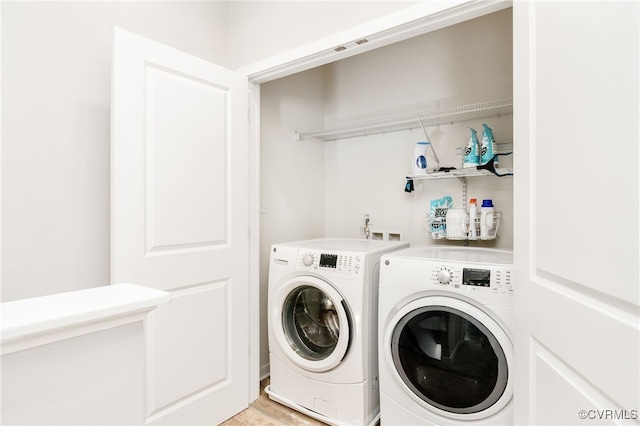 washroom with laundry area and washing machine and dryer