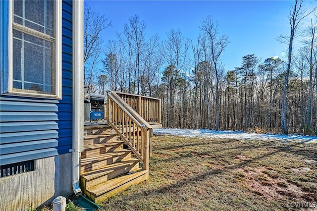 view of yard featuring a deck and stairs