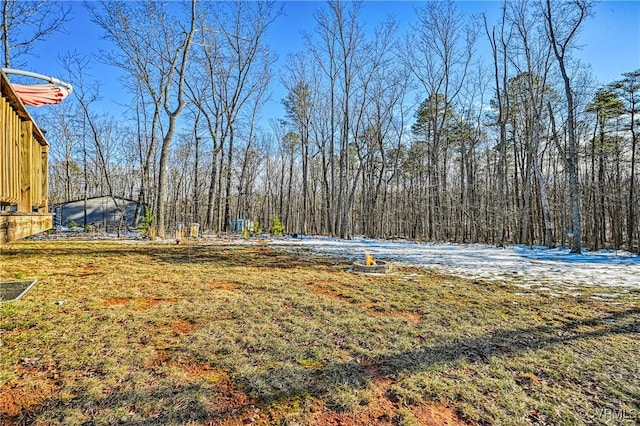 view of yard with a wooded view