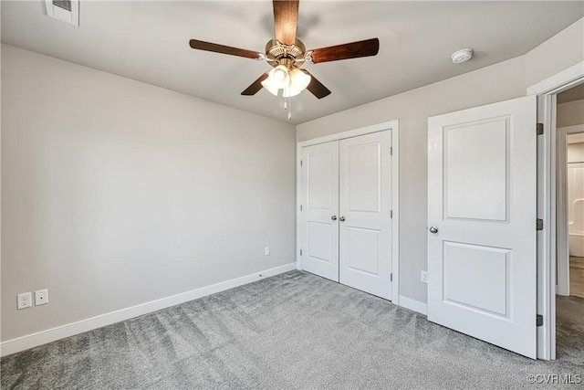 unfurnished bedroom with visible vents, ceiling fan, baseboards, carpet, and a closet