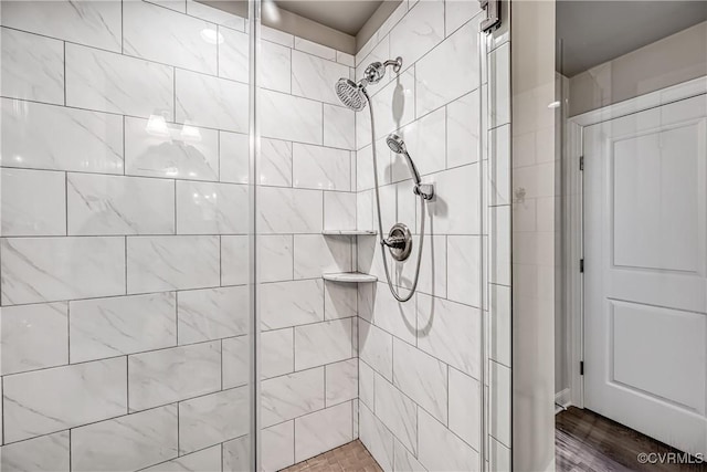 full bathroom with tiled shower